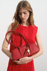 Profile view of model wearing the Oroton Ruffle Detail Top in Red Ribbon and 100% cotton voile fabric for Women .