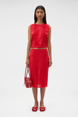 Profile view of model wearing the Oroton Ruffle Detail Top in Red Ribbon and 100% cotton voile fabric for Women .