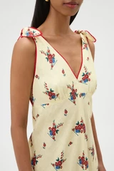 Profile view of model wearing the Oroton Wallpaper Floral Print Dress in Lemon and 100% midweight linen fabric for Women .