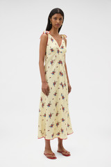 Profile view of model wearing the Oroton Wallpaper Floral Print Dress in Lemon and 100% midweight linen fabric for Women .