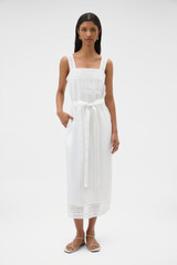 Profile view of model wearing the Oroton Lace Trim Slip Dress in White and 100% ramie fabric for Women .