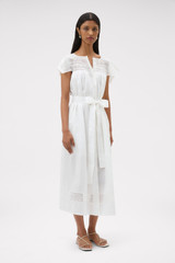 Profile view of model wearing the Oroton Lace Trim Day Dress in White and 100% ramie fabric for Women .
