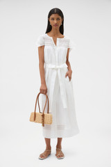 Profile view of model wearing the Oroton Lace Trim Day Dress in White and 100% ramie fabric for Women .
