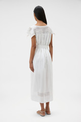 Profile view of model wearing the Oroton Lace Trim Day Dress in White and 100% ramie fabric for Women .