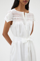 Profile view of model wearing the Oroton Lace Trim Day Dress in White and 100% ramie fabric for Women .