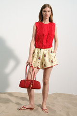 Profile view of model wearing the Oroton Wallpaper Floral Print Short in Lemon and 100% midweight linen fabric for Women .