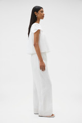 Profile view of model wearing the Oroton Lace Trim Pyjama Pant in White and 100% ramie fabric for Women .