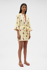 Profile view of model wearing the Oroton Wallpaper Floral Print Tunic Dress in Lemon and 100% midweight linen fabric for Women .