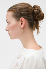 Profile view of model wearing the Oroton Felicity Hook Earrings in Pearl/Gold and Brass material for Women .