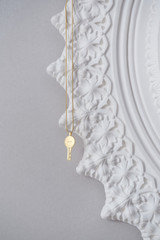 Detail product shot of the Oroton Billie Key Pendant in Worn Gold and Brass material for Women .