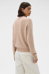Profile view of model wearing the Oroton Cashmere Blend Cardigan in Biscotti and 70% ultra fine merino wool and 30% cashmere blend fabric for Women .