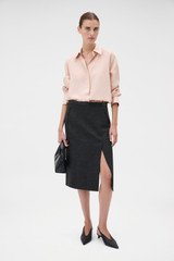 Profile view of model wearing the Oroton Long Sleeve Shirt in Rose Tint and 100% silk habotai fabric for Women .