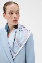 Profile view of model wearing the Oroton The Schoolboy Scarf in Smoke Blue and 100% silk twill fabric for Women .