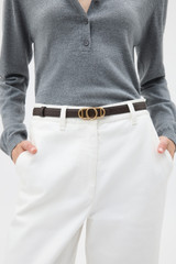 Profile view of model wearing the Oroton Juliette Smooth Reversible Belt in Espresso/Cinnamon and Premium smooth leather for Women .