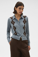Profile view of model wearing the Oroton Argyle Cardigan in Grey Marle and 55% extra fine merino wool and 45% cotton blend fabric for Women .