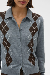 Profile view of model wearing the Oroton Argyle Cardigan in Grey Marle and 55% extra fine merino wool and 45% cotton blend fabric for Women .
