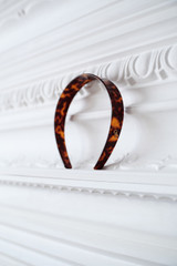 Detail product shot of the Oroton Daphne Headband in Tort/Brass and Acetate and brass material for Women .