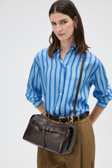 Profile view of model wearing the Oroton Cleo Crackle Shoulder Bag in True Chocolate and Premium crackle leather for Women .