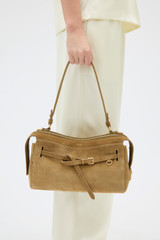 Profile view of model wearing the Oroton Cleo Suede Shoulder Bag in Tobacco and Premium suede leather for Women .