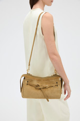 Profile view of model wearing the Oroton Cleo Suede Shoulder Bag in Tobacco and Premium suede leather for Women .