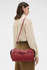 Profile view of model wearing the Oroton Cleo Smooth Shoulder Bag in Garnet and Premium smooth leather for Women .