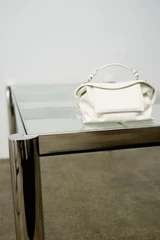 Detail product shot of the Oroton Mica Smooth Bowler in Warm White and Premium smooth leather for Women .
