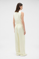 Profile view of model wearing the Oroton Double Satin Pyjama Pant in Champagne and 100% viscose fabric for Women .