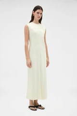 Profile view of model wearing the Oroton Double Satin Sheath Dress in Champagne and 100% viscose fabric for Women .