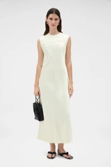 Profile view of model wearing the Oroton Double Satin Sheath Dress in Champagne and 100% viscose fabric for Women .