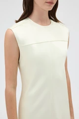 Profile view of model wearing the Oroton Double Satin Sheath Dress in Champagne and 100% viscose fabric for Women .