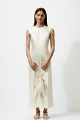 Profile view of model wearing the Oroton Double Satin Sheath Dress in Champagne and 100% viscose fabric for Women .