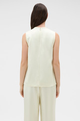 Profile view of model wearing the Oroton Double Satin Tank in Champagne and 100% viscose fabric for Women .