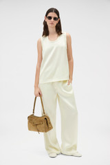 Profile view of model wearing the Oroton Double Satin Tank in Champagne and 100% viscose fabric for Women .