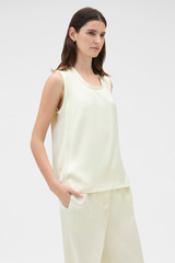 Profile view of model wearing the Oroton Double Satin Tank in Champagne and 100% viscose fabric for Women .