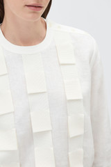 Profile view of model wearing the Oroton Folded Ribbon Top in Antique White and 100% linen fabric for Women .
