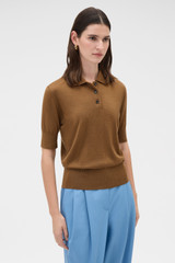 Profile view of model wearing the Oroton Knit Polo Top in Dark Rye and 90% merino wool and 10% silk blend fabric for Women .