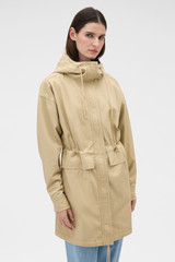 Profile view of model wearing the Oroton Washed Twill Parka in Soft Camel and 100% cotton twill fabric for Women .