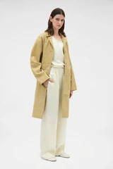 Profile view of model wearing the Oroton Suede Coat in Sepia and 100% suede leather for Women .