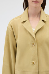 Profile view of model wearing the Oroton Suede Coat in Sepia and 100% suede leather for Women .
