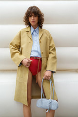 Profile view of model wearing the Oroton Suede Coat in Sepia and 100% suede leather for Women .