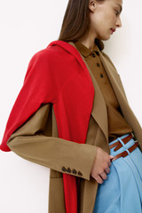 Profile view of model wearing the Oroton Single Breasted Blazer in Dark Rye and 100% wool fabric for Women .