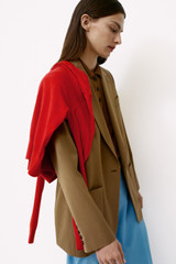 Profile view of model wearing the Oroton Single Breasted Blazer in Dark Rye and 100% wool fabric for Women .