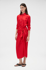 Profile view of model wearing the Oroton Silk Sarong Dress in Poppy and 100% silk twill fabric for Women .