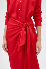 Profile view of model wearing the Oroton Silk Sarong Dress in Poppy and 100% silk twill fabric for Women .