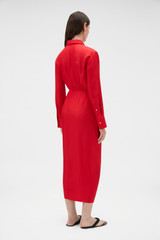 Profile view of model wearing the Oroton Silk Sarong Dress in Poppy and 100% silk twill fabric for Women .