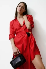Profile view of model wearing the Oroton Silk Sarong Dress in Poppy and 100% silk twill fabric for Women .