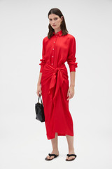 Profile view of model wearing the Oroton Silk Sarong Dress in Poppy and 100% silk twill fabric for Women .