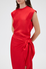 Profile view of model wearing the Oroton Silk Sarong Skirt in Poppy and 100% silk twill fabric for Women .