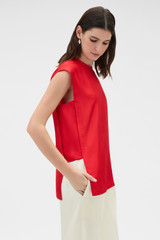 Profile view of model wearing the Oroton Silk Shell Top in Poppy and 100% silk twill fabric for Women .
