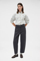 Profile view of model wearing the Oroton Washed Twill Barrel Leg Pant in Washed Black and 100% cotton fabric for Women .